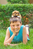 boy playing with a puppy