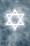 Glowing Star of David in clouds