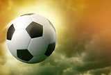 3d soccer ball on dramatic sky background 