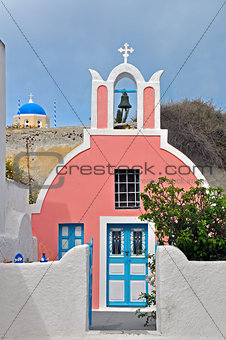 pink church on greek santorini island, greece