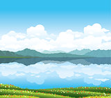 Nature landscape with grass and lake.
