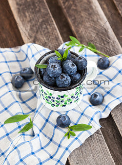 Fresh blueberry in the mug