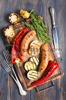 Sausage and vegetables cooked on the grill.