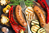 Sausages and grilled vegetables closeup.