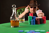 Poker player wearing sunglasses and hat
