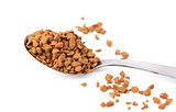 Closeup of a teaspoon of instant coffee granules