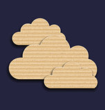 Carton paper clouds isolated on dark background