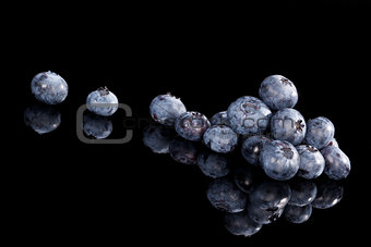 Blueberries isolated on black.