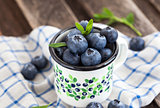 Fresh blueberry in the mug 