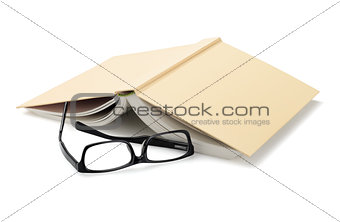 Spectacles Beside Inverted Book
