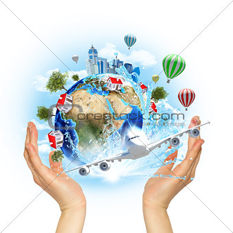 Hands hold Earth with buildings and trees
