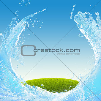 Green meadow and water splash