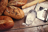 Homemade breads with cooking utensils