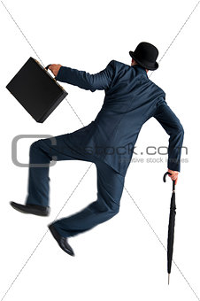 businessman jumping and kicking his heels isolated on white 