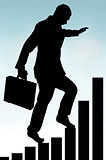 businessman climbing a bar chart silhouette 
