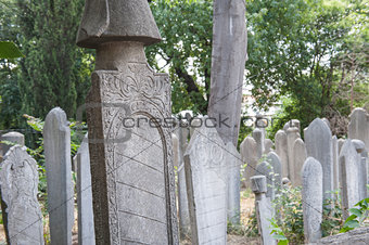 Ornate turkish headstones in graveyard