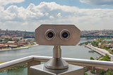 Binoculars on viewing platform overlooking river