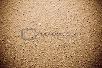 brown structural painted wallpaper on the wall
