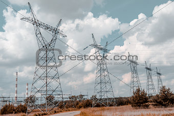Pylon and transmission power line in summer day