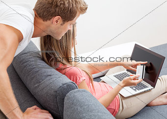 Happy couple shopping online 