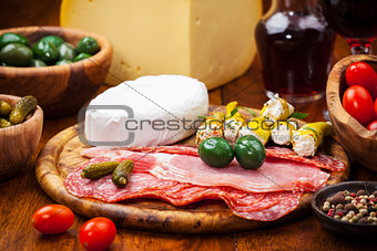 Antipasto catering platter with cheese loaf