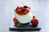 traditional summer dessert pavlova with fresh berries