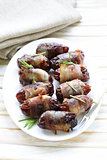 appetizer delicacy dates wrapped in bacon and fried