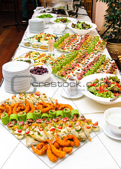 Table with various delicious appetizer