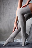Beautiful woman legs in grey stockings 