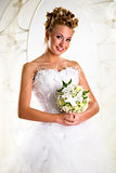 Beautiful bride with bouquet of flowers