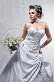 Beautiful bride holding wedding bouquet