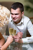 Young couple with champagne glasses