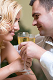 Young couple with champagne glasses