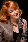Beautiful redhead young woman singing