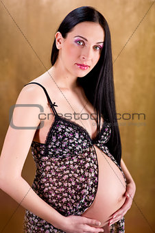 Attractive pregnant woman indoors