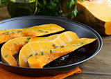 pumpkin baked with herbs and spices in a pan