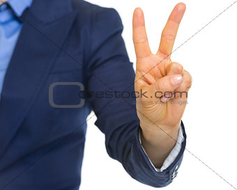 Closeup on business woman showing 2 fingers