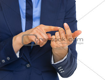 Closeup on business woman counting on fingers