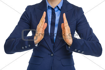 Closeup on business woman showing size with hands