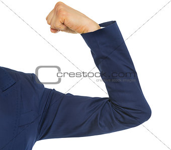 Closeup on business woman showing biceps
