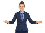 Portrait of happy business woman welcoming