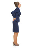 Full length portrait of business woman with back pain