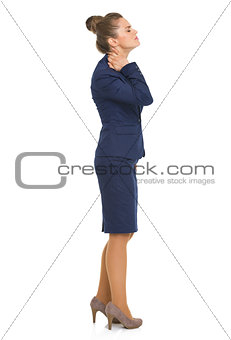 Full length portrait of business woman with neck pain