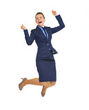 Full length portrait of happy business woman jumping