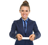 Portrait of happy business woman showing business card