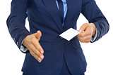 Closeup on business woman showing business card and stretching h