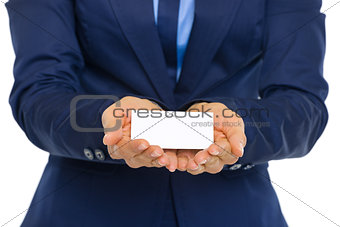 Closeup on business woman showing business card