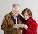 Excited Couple with Tablet