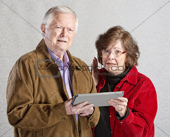 Confused Adults with Tablet
