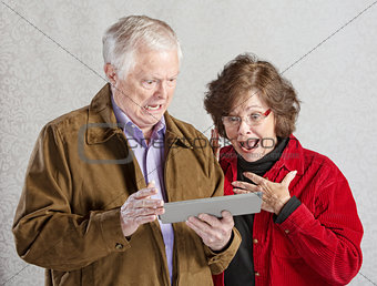 Shocked Couple with Tablet